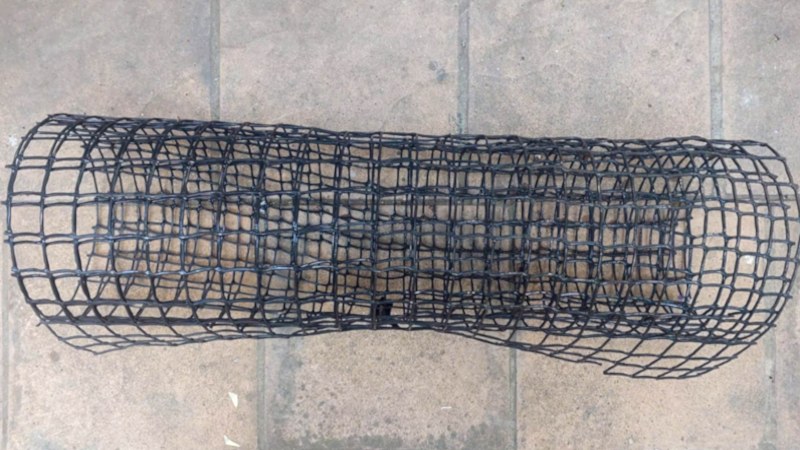 A roll of plastic covered wire mesh used to make the gabion cage