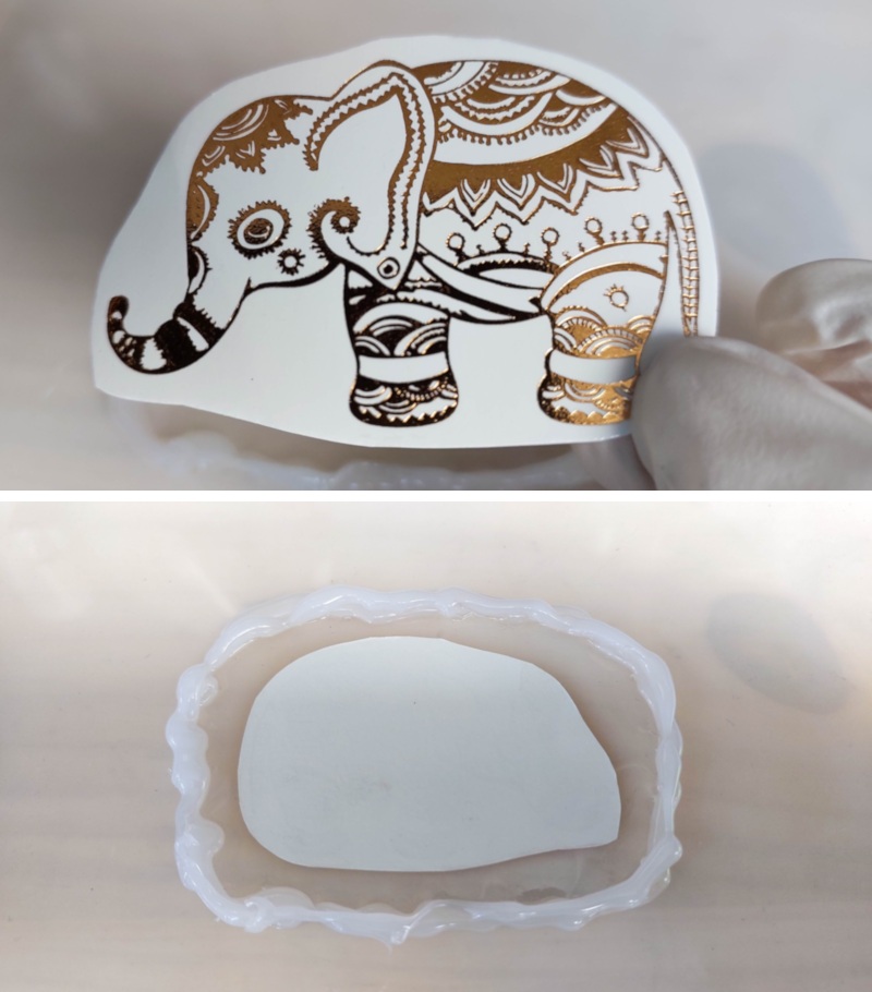 Cut out the temporary tattoo and place it face down on the resin