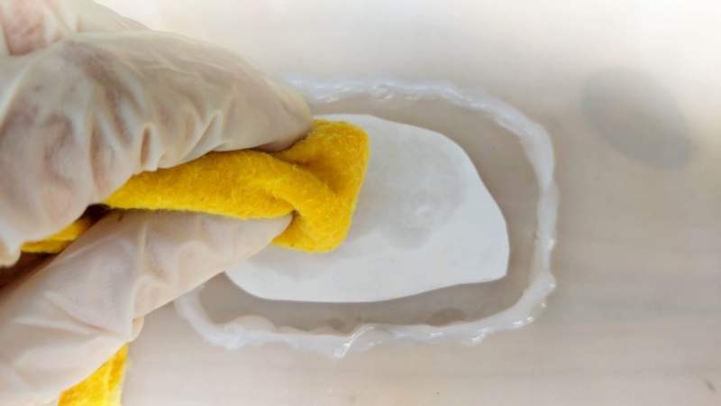 Use a damp cloth and wipe the back of the temporary tattoo